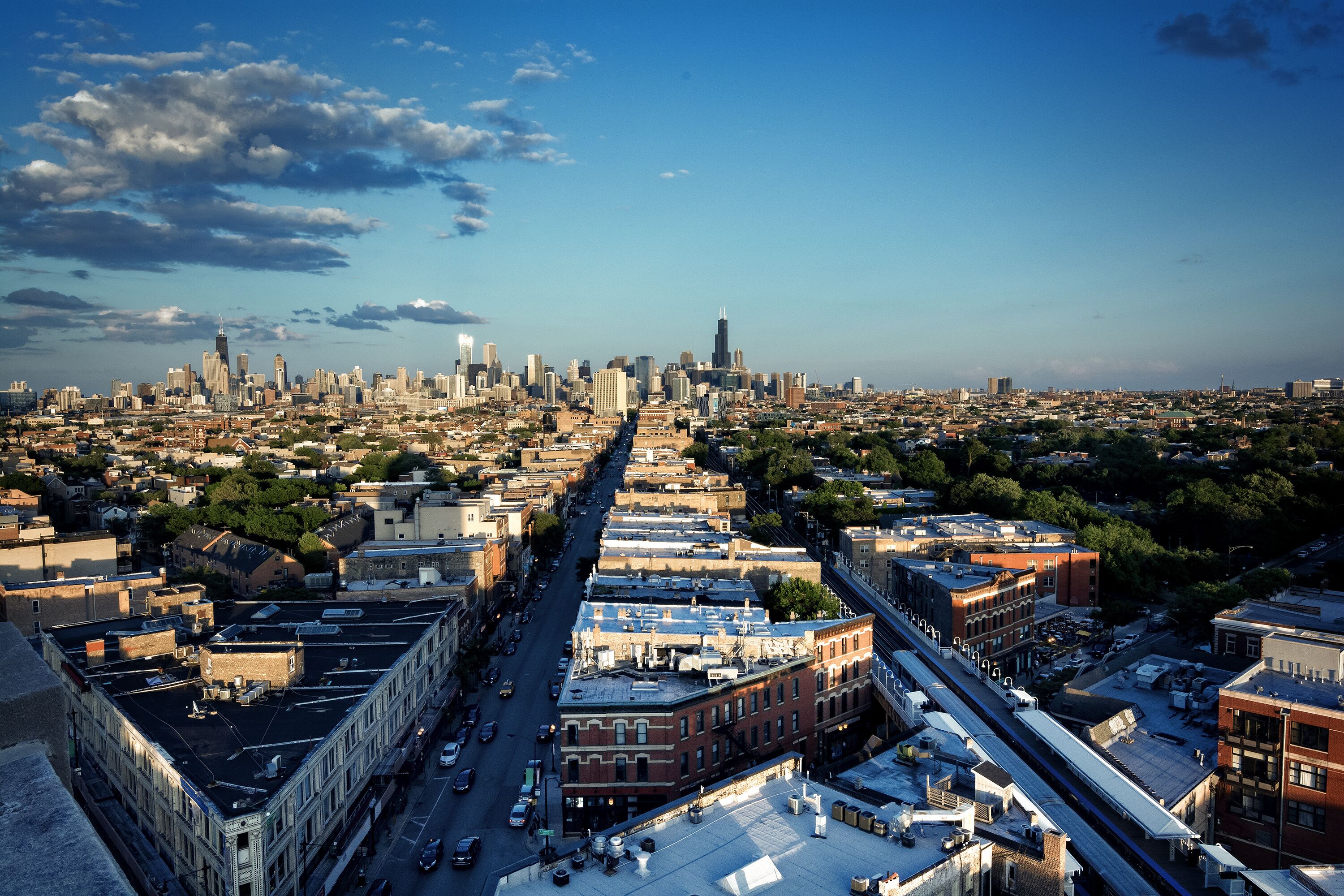 Chicago aerial skyline from the northwest side with dramatic sky and clouds.