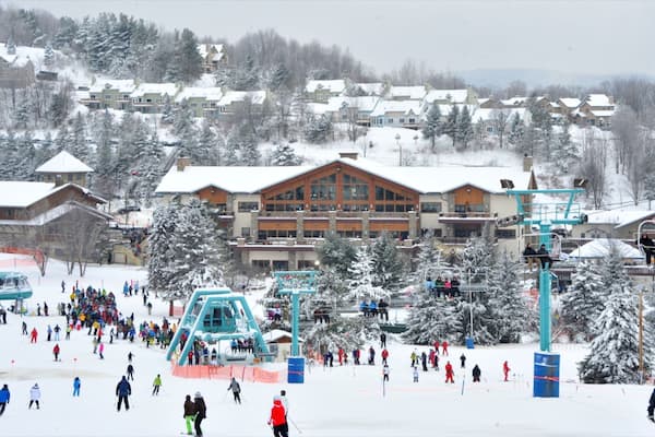 Holiday Valley Ski Area featuring a gondola, a luxury hotel or resort and snow skiing