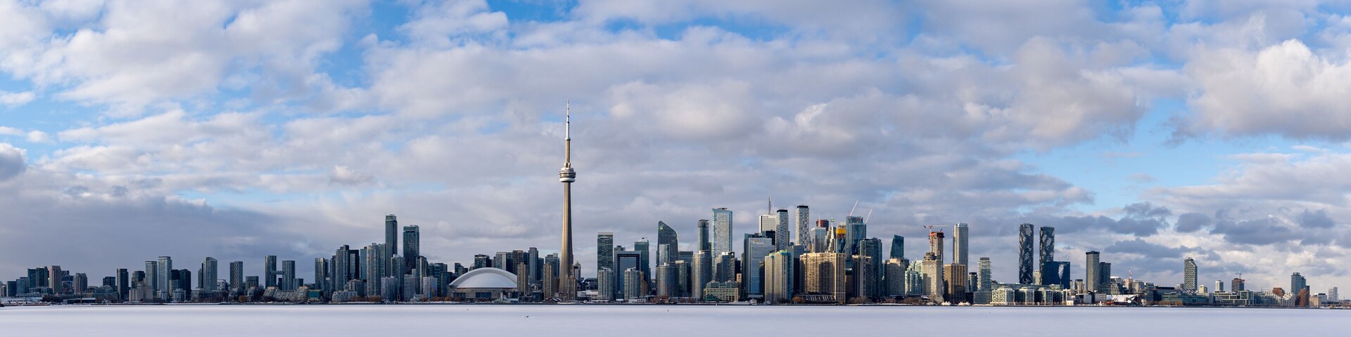 Frozen Lake Ontario and downtown Toronto panoramic view from Toronto Islands in winter.