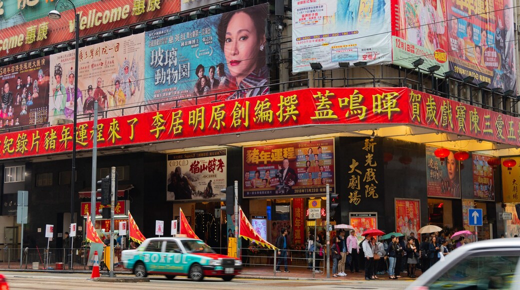 Sunbeam Theatre showing signage, street scenes and a city
