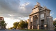 Gate of Toledo which includes a sunset and heritage architecture