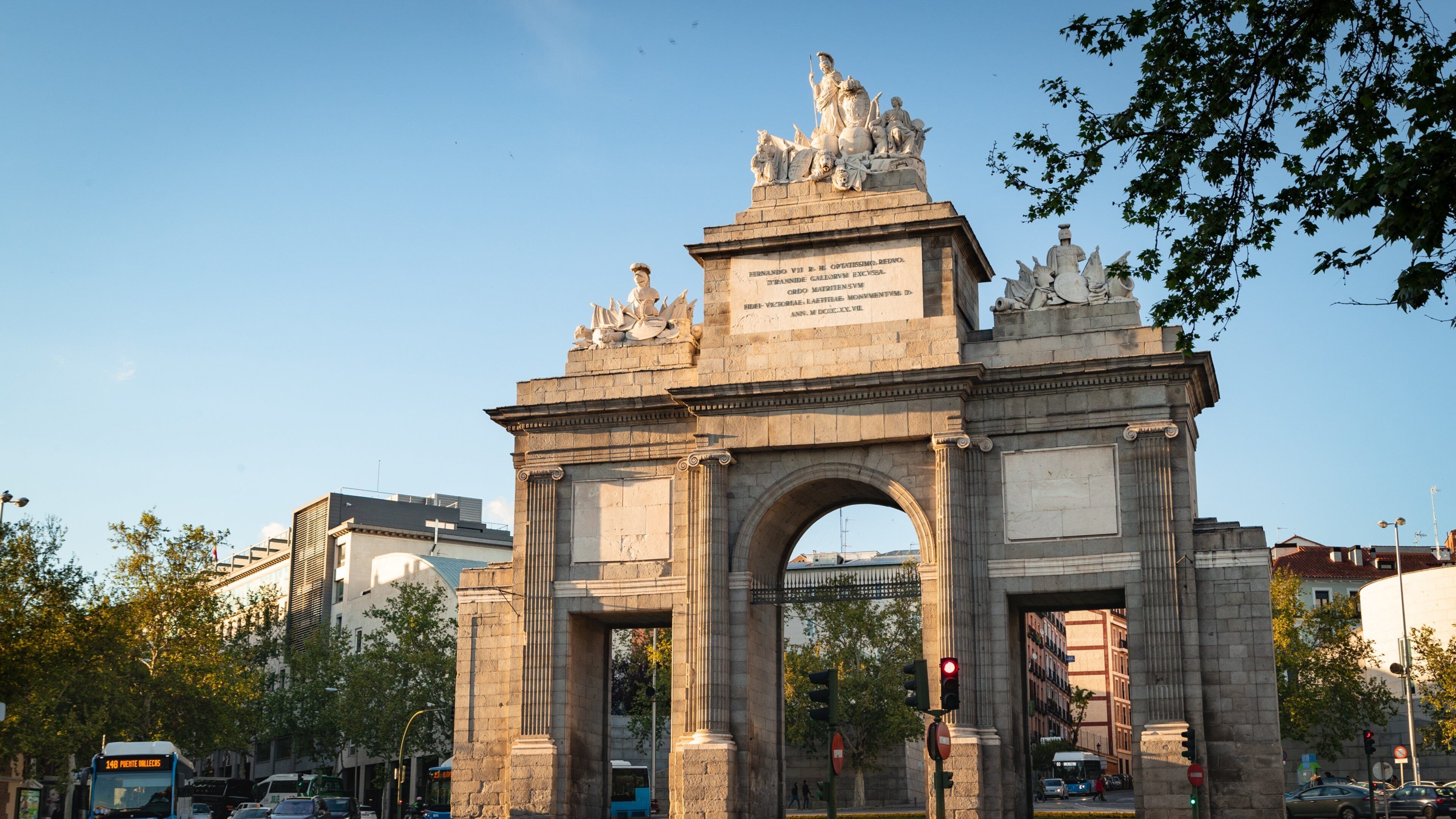 Puerta de Toledo showing heritage architecture and a sunset
