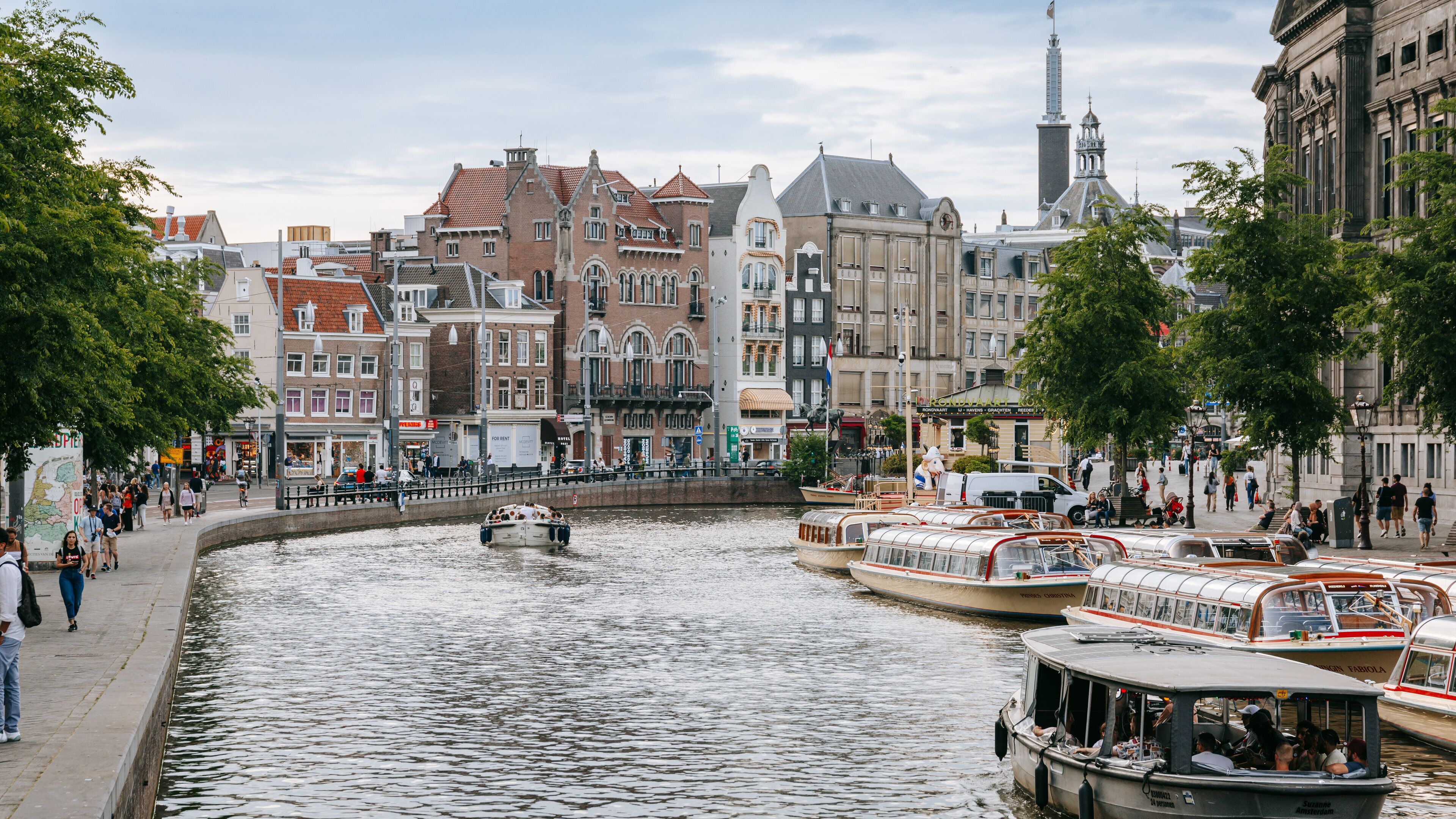 Old Town Amsterdam showing boating, a river or creek and a city