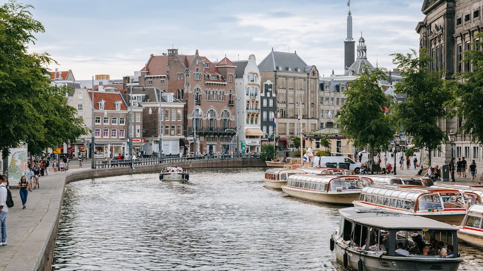 Old Town Amsterdam showing boating, a river or creek and a city