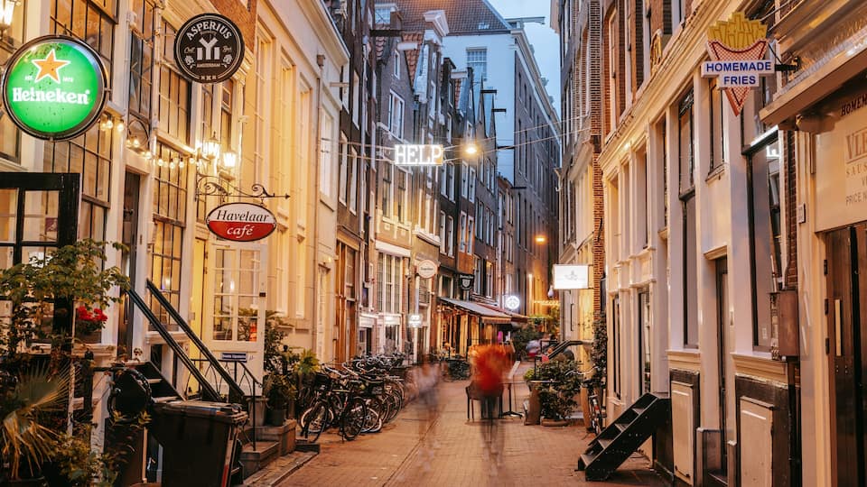 Old Town Amsterdam which includes night scenes and a city