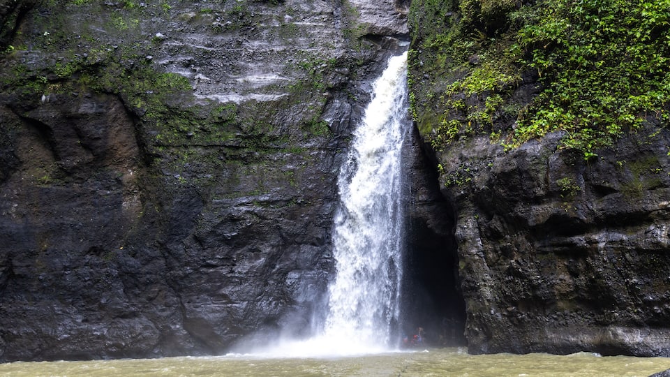 A waterfall cascading down a rocky cliff.