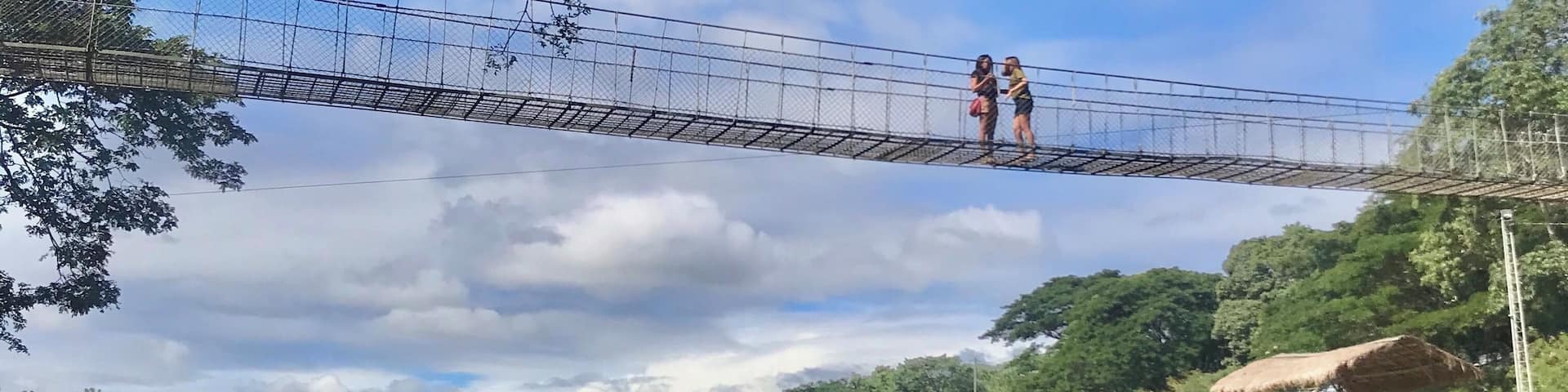 MINALUNGAO NATIONAL PARK
3-4hours drive from Manila
Unexpected treasure hidden deep
in the province of General Tinio Nueva Ecija.
Photo shows 2 locale men manouver the indegenous bamboo Raft full of Excursionist by paddle and another Guy pulling the rope while jumping alongside the rockies and help navigate the River.
Crossing the Penaranda River thru hanging Bridge, Ziplining and walk 1000 steps thru the woods towards the top of the Hills are few activities this place has to offer for a day visit.
Good for outdoor enthusiast.