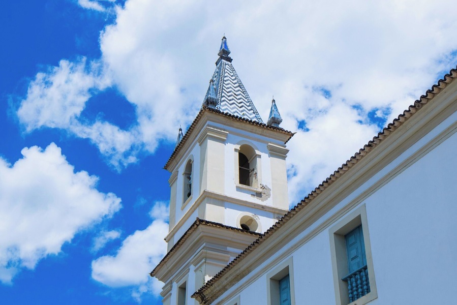 A bell tower of Igreja Matriz de Nossa Senhora do Rosário. The tiling pattern is found in two other bell towers in the region. Cachoeira, Bahia, Brazil.
