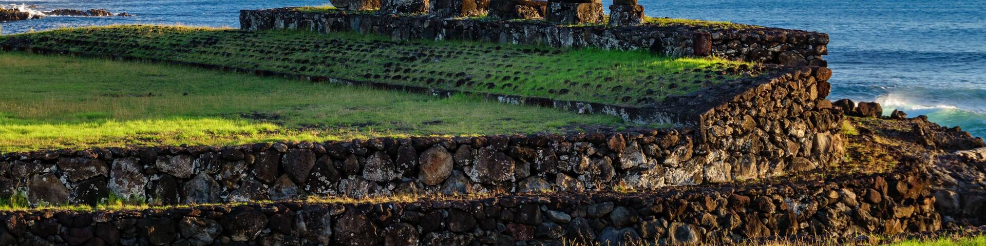 Ahu Tahai against ocean and Hanga Roa in Rapa Nui