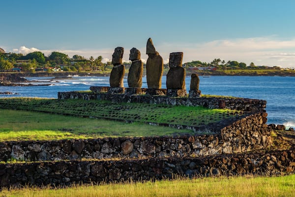 Ahu Tahai against ocean and Hanga Roa in Rapa Nui