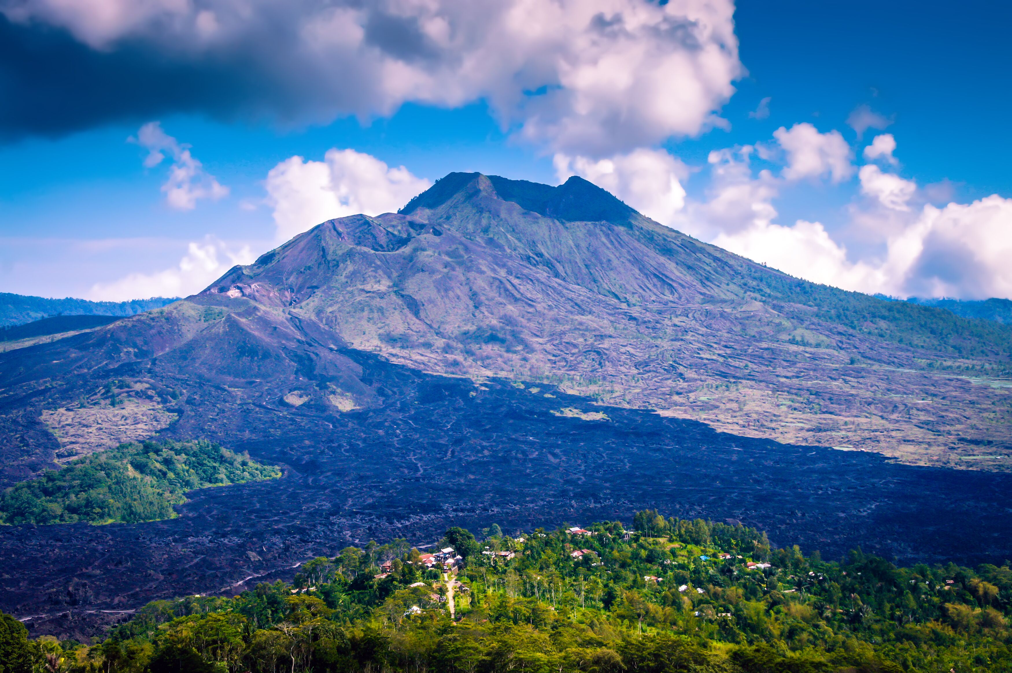 Mount Agung in Bali. Mount Agung on the resort island Bali, Indonesia. Smoking Bali volcano Mount Agung. Mount Agung Located on Indonesia main island, the volcano. Volcano Bali mountain eruption lava