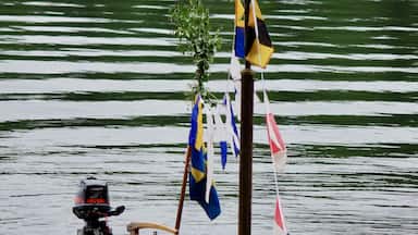 Decorated sailboat mast at midsummer holiday in Sweden.