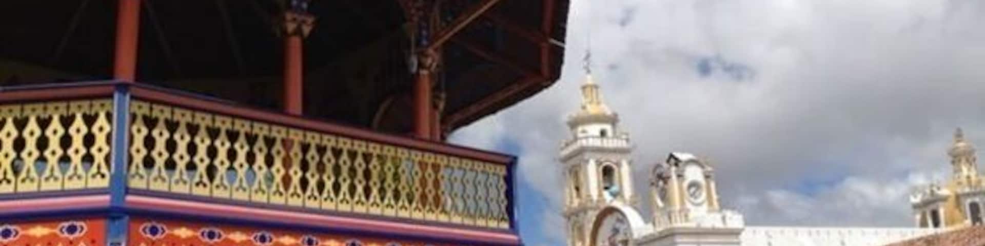 A 19th-century Mudejar kiosk sits at the center of an otherwise traditional town square. In the back, The Cathedral of the Immaculate Conception is a late 19th-century English Gothic revival church that serves as the cathedral of the Roman Catholic Diocese of Hong Kong