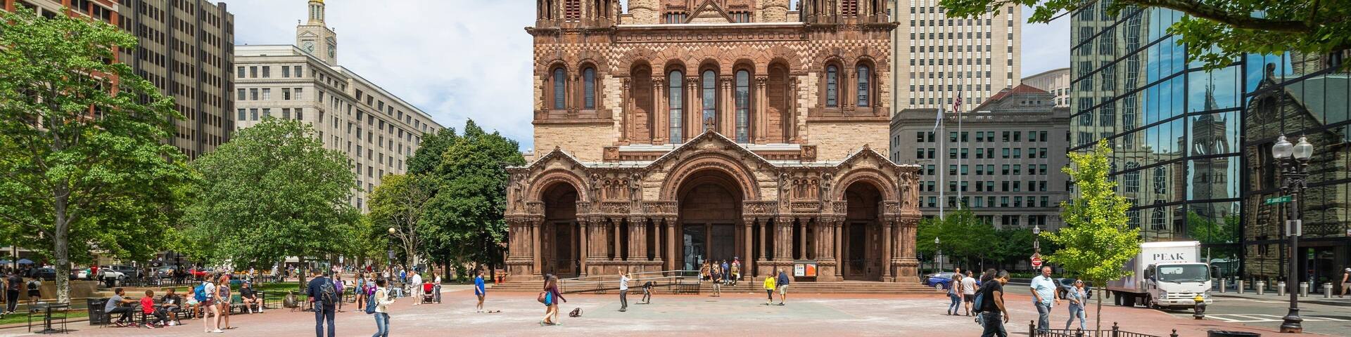 Trinity Church Boston showing heritage architecture, a city and a garden