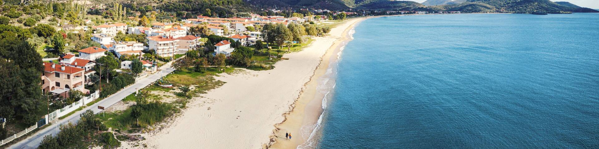 Idyllic aerial view of the sandy Toroni beach on the Sithonia peninsula in the Halkidiki region of Greece. Recreation and tourism concept