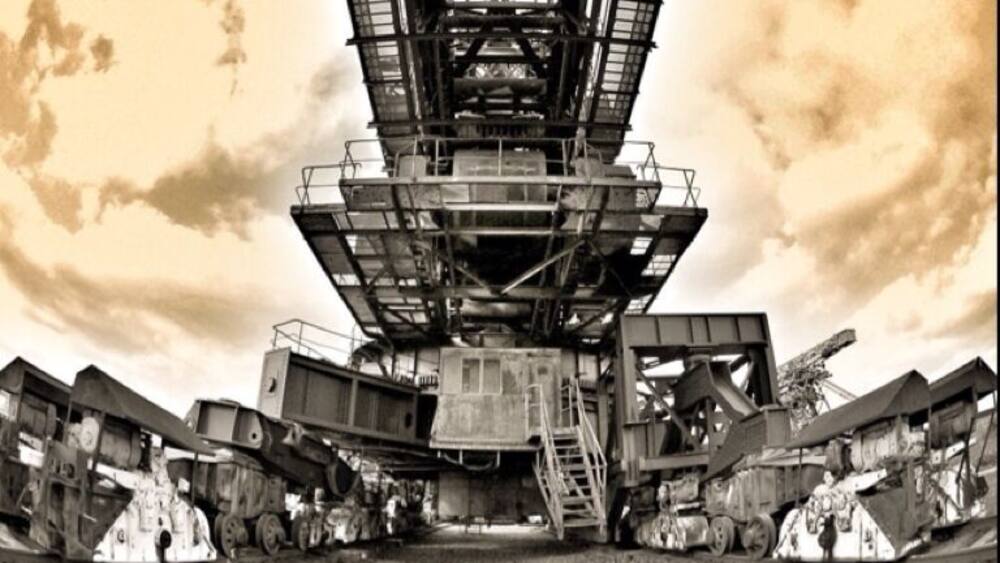 A large industrial structure with multiple levels and a complex framework.