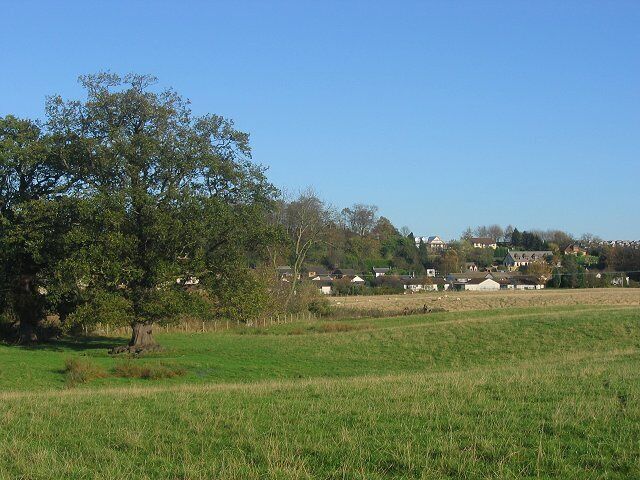 Crossford. The eastern part of Crossford, seen across farmland from the road to Limekilns. Looking NE.