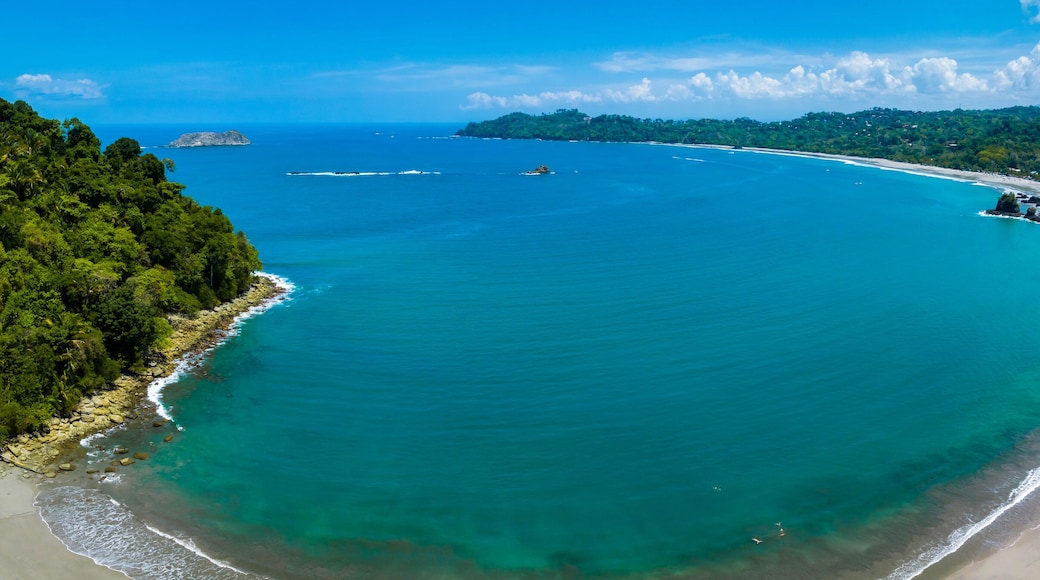 Aerial view of Manuel Antonio National Park in Costa Rica. The best Tourist Attraction and Nature Reserve with lots of Wildlife, Tropical Plants and paradisiacal Beaches on the Pacific Coast.