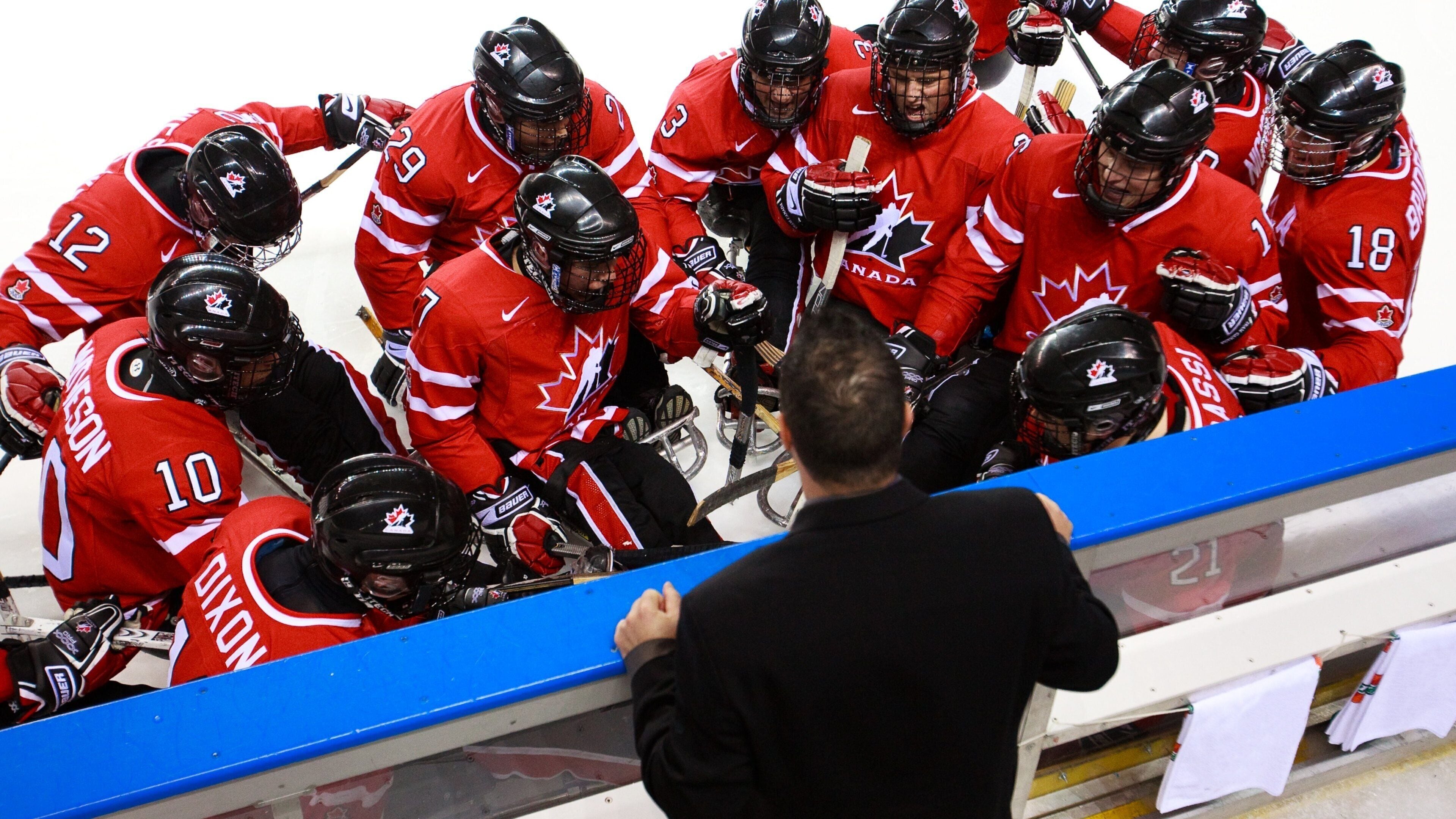 Doug Mitchell Thunderbird Sports Centre featuring a sporting event and interior views as well as a large group of people