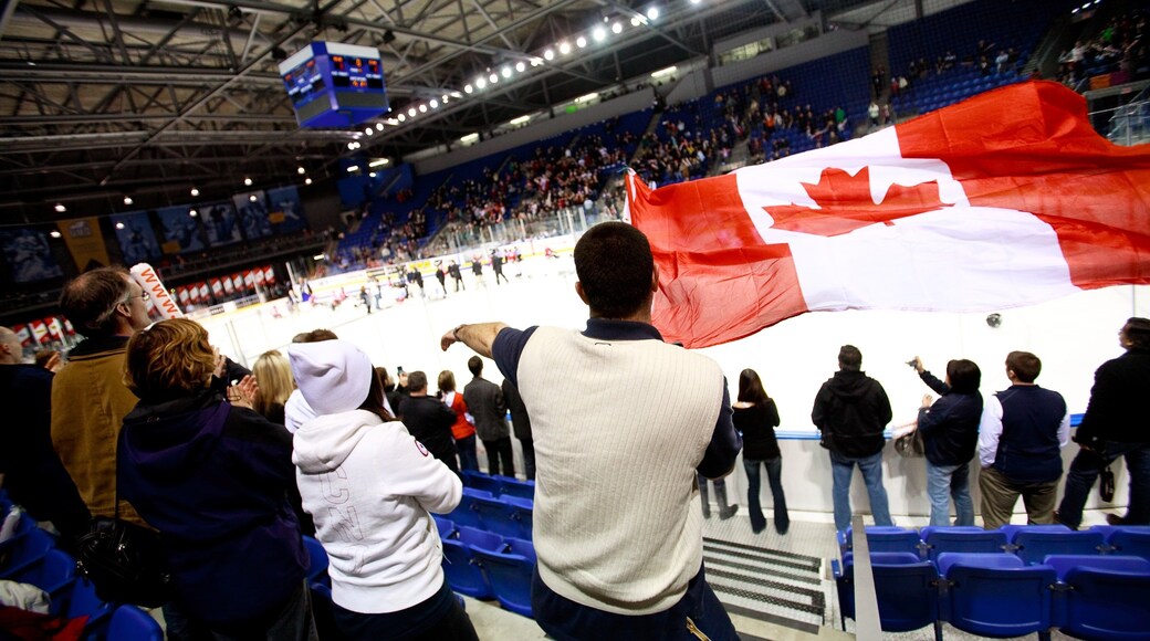 Doug Mitchell Thunderbird Sports Centre which includes a sporting event and interior views as well as a large group of people