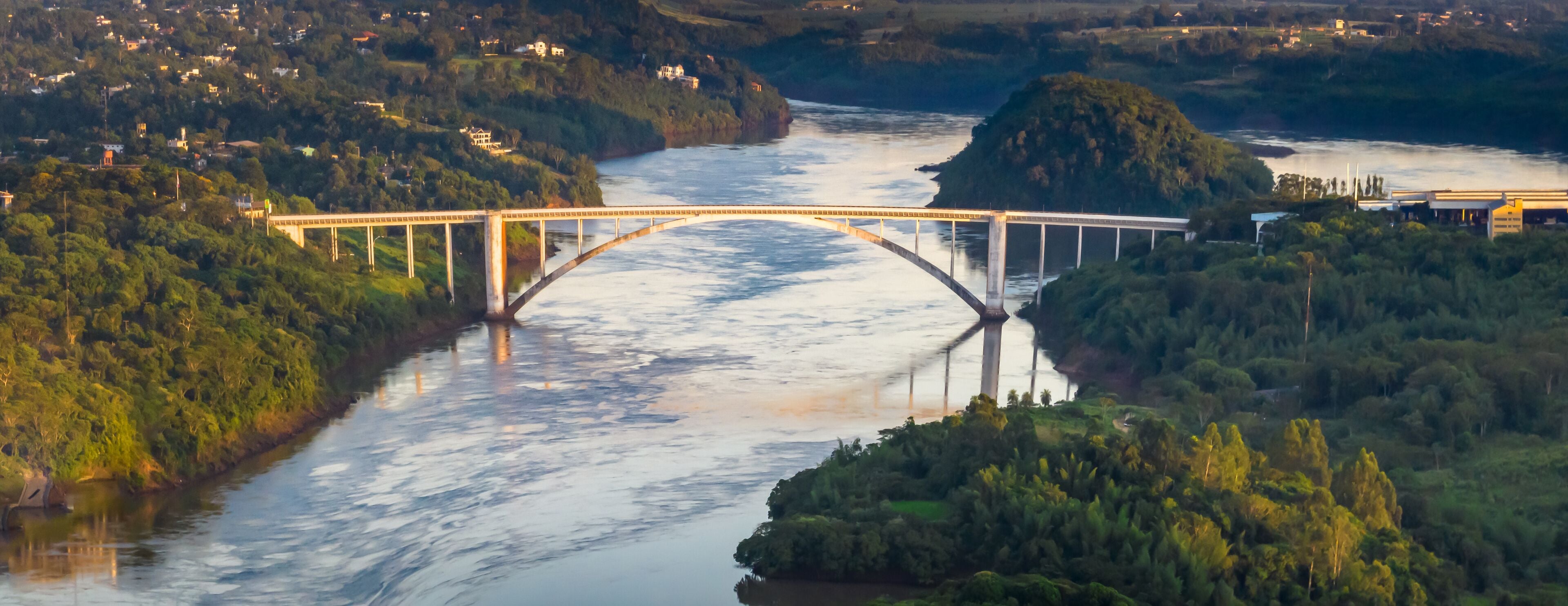 Border between Brazil and Paraguay and connects Foz do Iguaçu to Ciudad del Este. Ponte da Amizade in Foz do Iguaçu. Aerial view of the Friendship Bridge with Paraná river..
