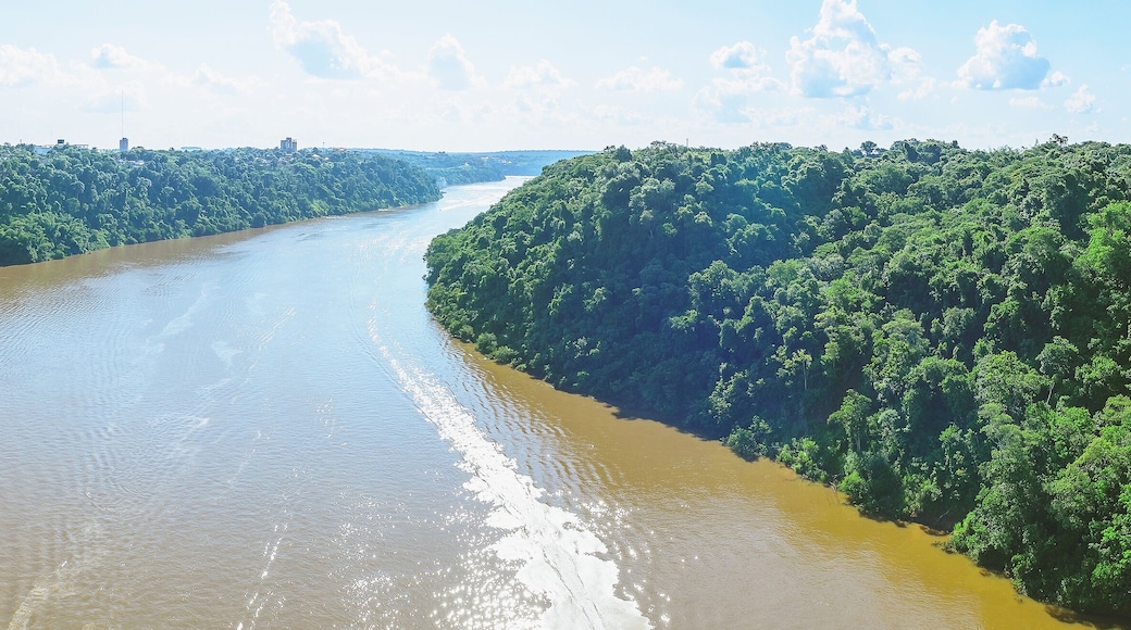 Panoramic photo taken over the Tancredo Neves bridge from the Iguacu river and the borders from Brazil and Argentina. On the right side is Brazil, on the left is Argentina.