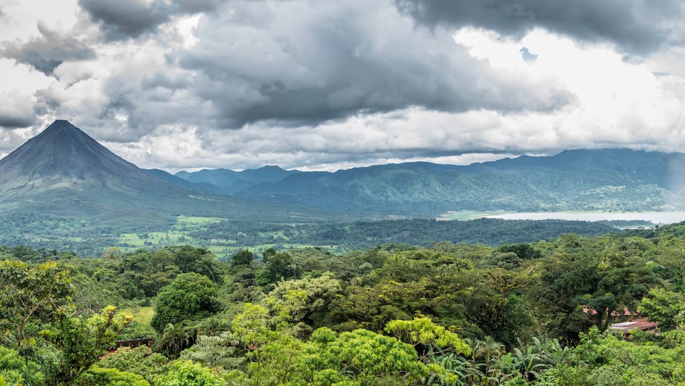 Arenal volcano and lake panorama.
