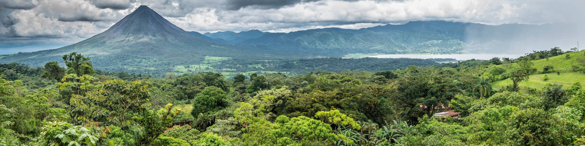 Arenal volcano and lake panorama.