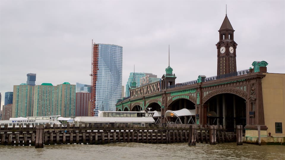 A historic bridge with a clock tower, a modern skyscraper, and a river.