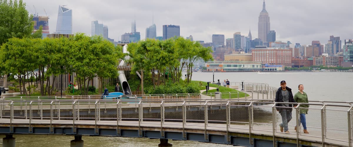 Pier A Park which includes a skyscraper, a river or creek and a city