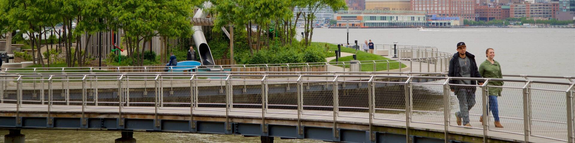 Pier A Park which includes a skyscraper, a river or creek and a city