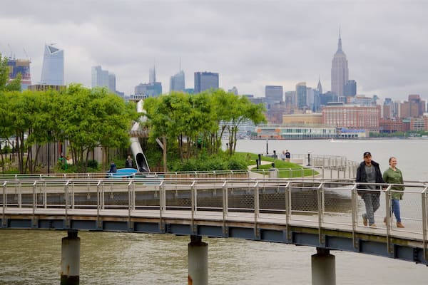 Pier A Park which includes a skyscraper, a river or creek and a city