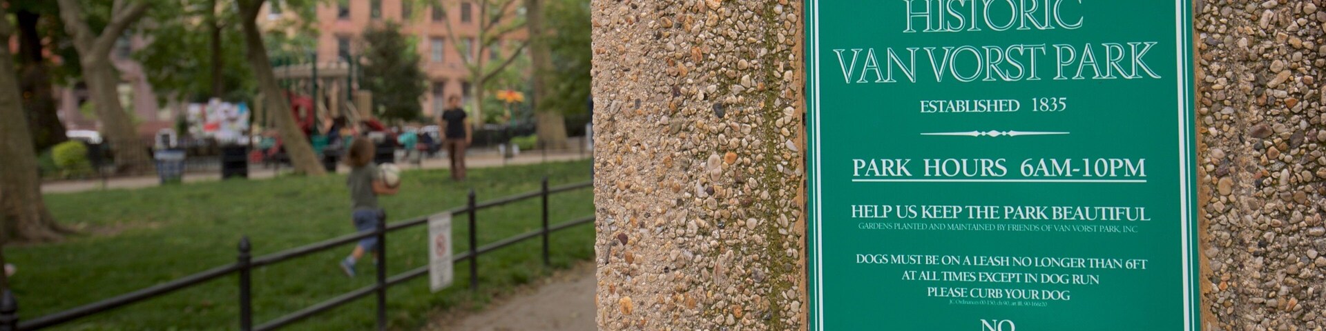 Van Vorst Park featuring signage and a park