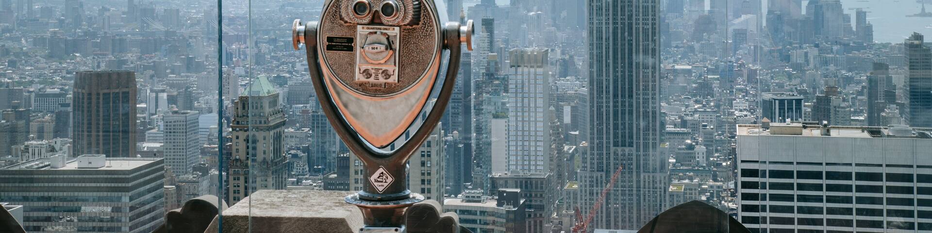 Top of the Rock which includes a skyscraper, a city and views