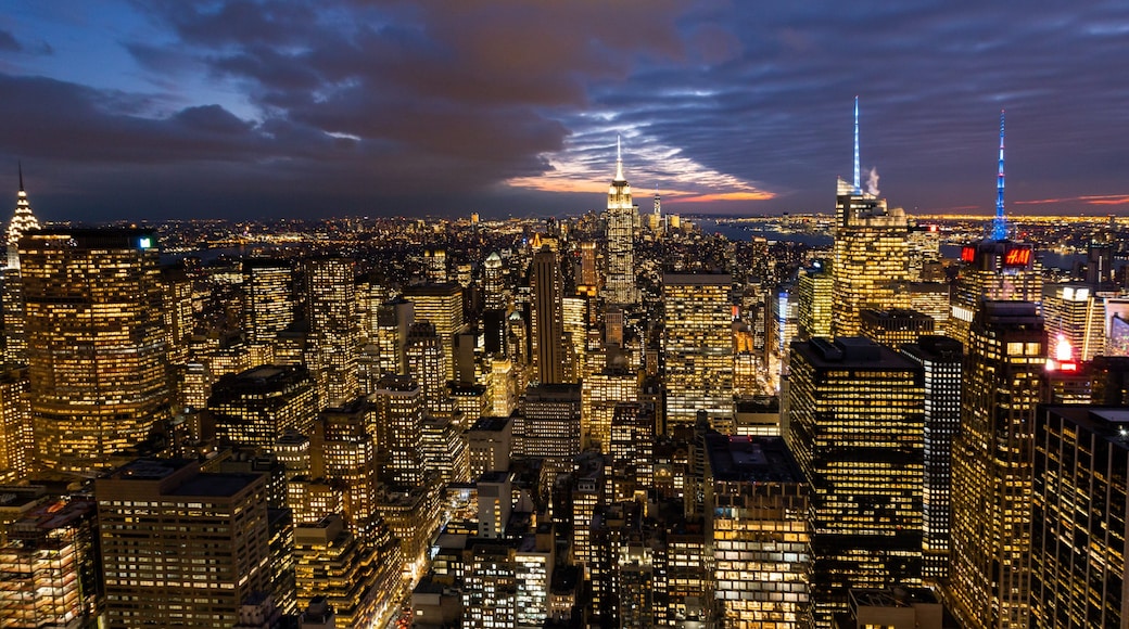 Top of the Rock showing a city, night scenes and landscape views