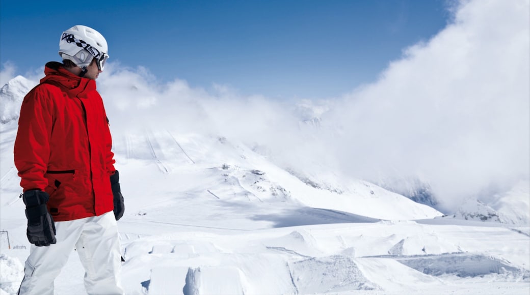 Hintertux Glacier Ski Resort featuring snow and mist or fog as well as an individual male