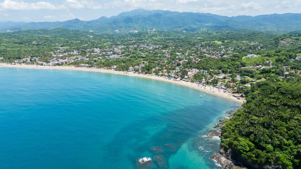 Lo de marcos showing crystal clear waters and sandy beach, a typical mexican village on the riviera nayarit