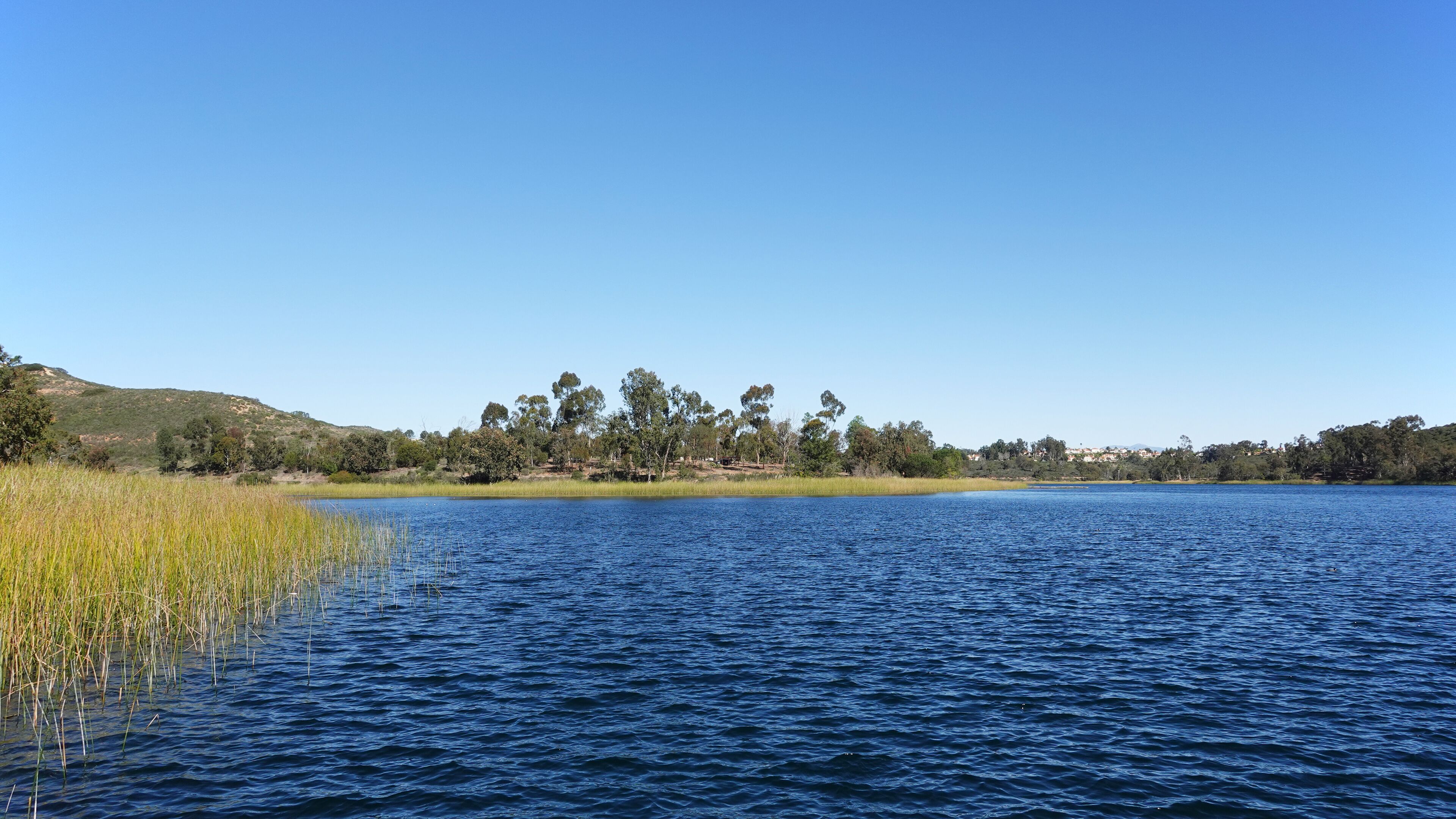 View of Lake Miramar and walking trail at Miramar reservoir in San Diego, California.