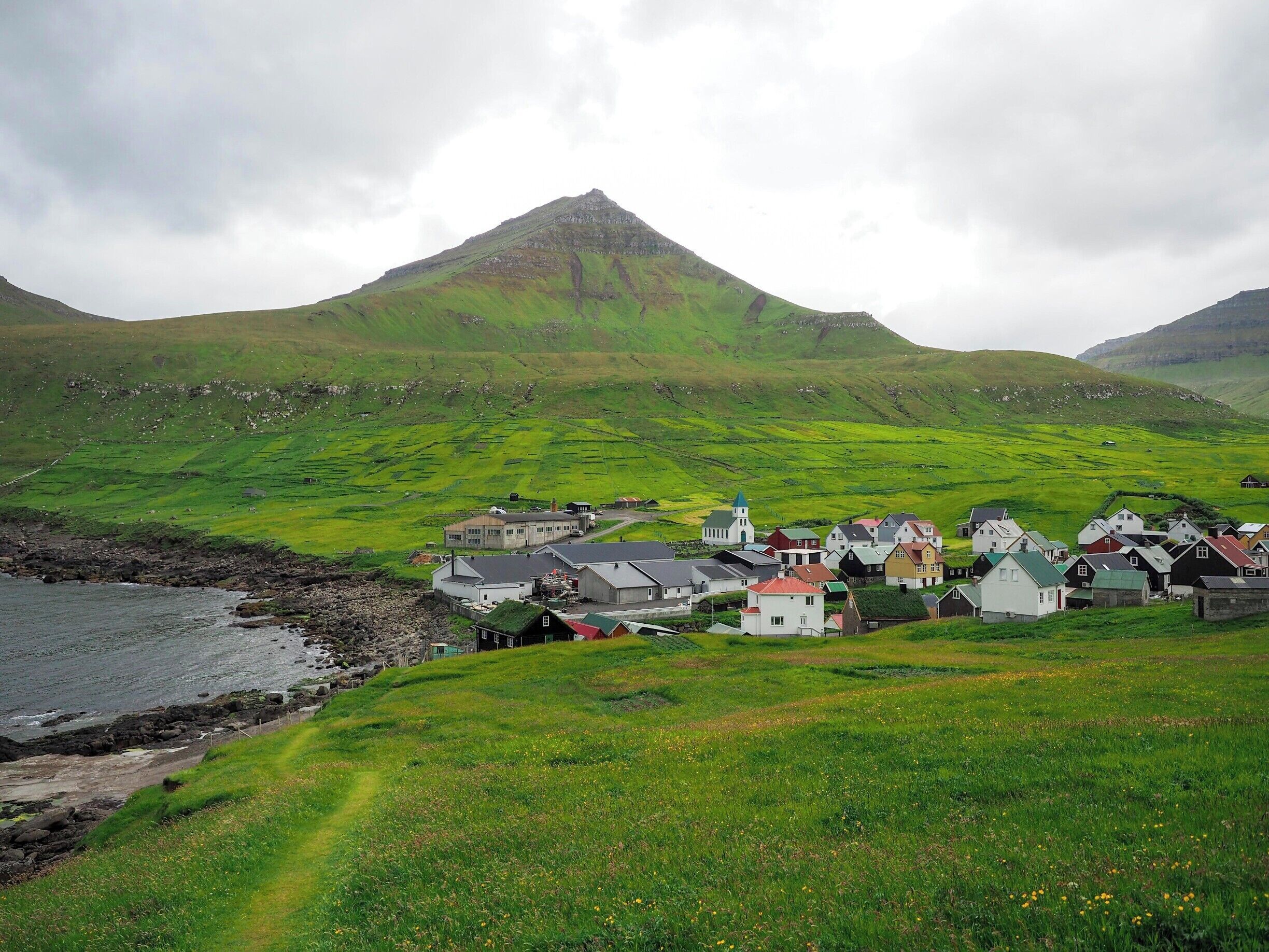 The tiny town of Gjógv is the most northern village on the island of Eysturoy in the Faroe Islands. Its name actually just means "gorge," and there is indeed a nice little gorge here leading out to the sea.

Gjógv also has a guesthouse and some nice hiking trails, and is only about an hour's drive from Torshavn.