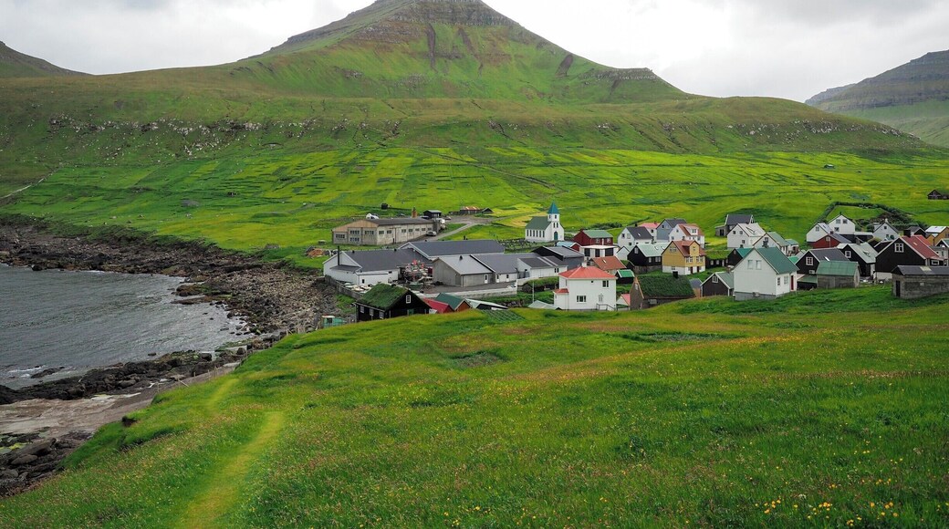 The tiny town of Gjógv is the most northern village on the island of Eysturoy in the Faroe Islands. Its name actually just means "gorge," and there is indeed a nice little gorge here leading out to the sea.
Gjógv also has a guesthouse and some nice hiking trails, and is only about an hour's drive from Torshavn.