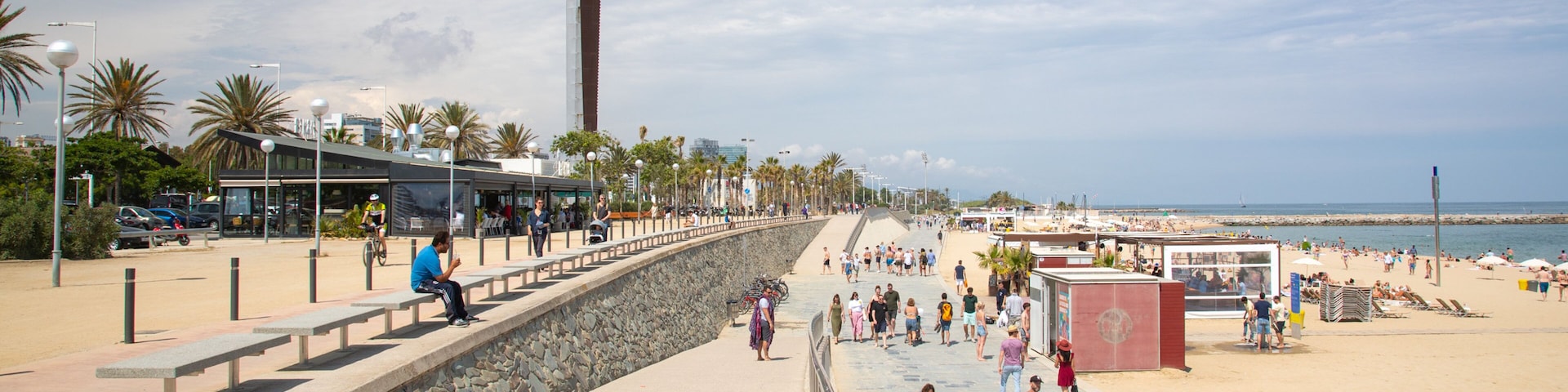 Bogatell Beach which includes a beach and general coastal views