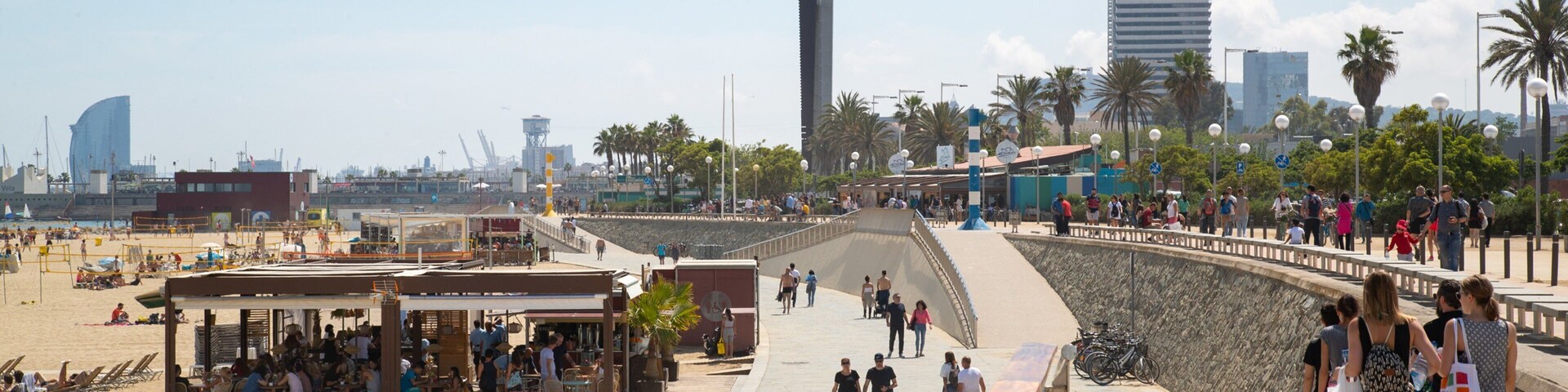 Bogatell Beach which includes a sandy beach, a coastal town and general coastal views