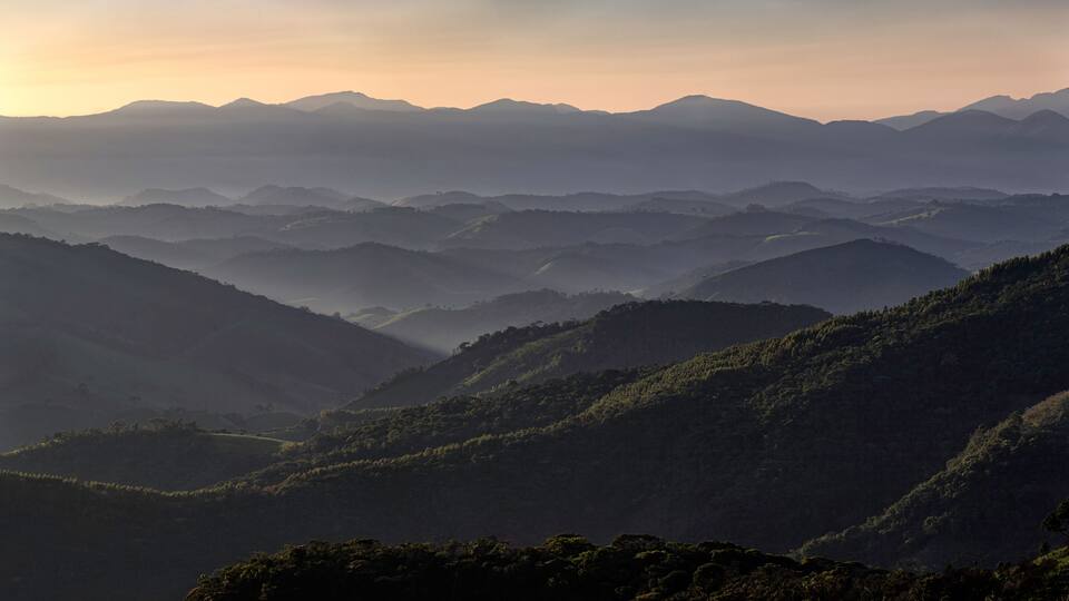 A mountainous landscape with rolling hills and valleys.