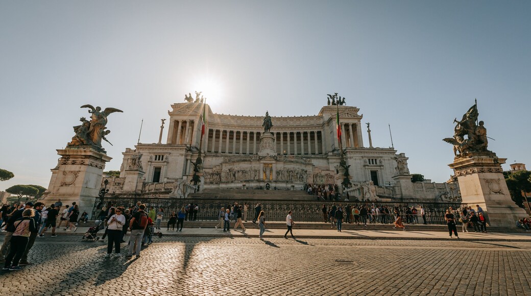 National Monument to Victor Emmanuel II featuring heritage architecture, street scenes and a sunset
