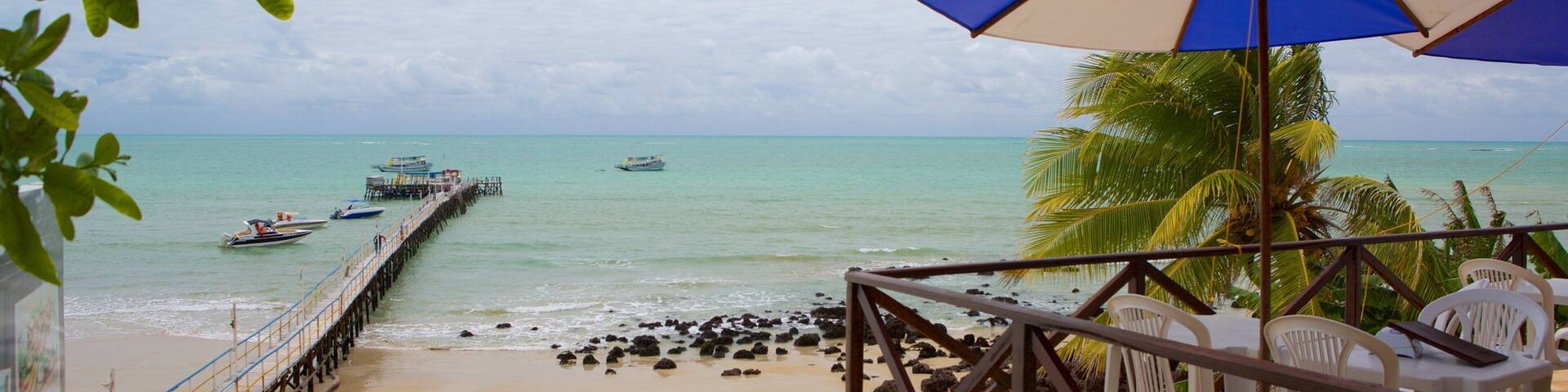 Pirangi Beach which includes a beach and general coastal views