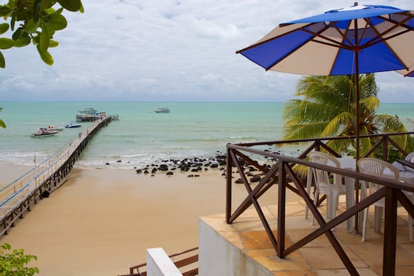 Pirangi Beach which includes a beach and general coastal views