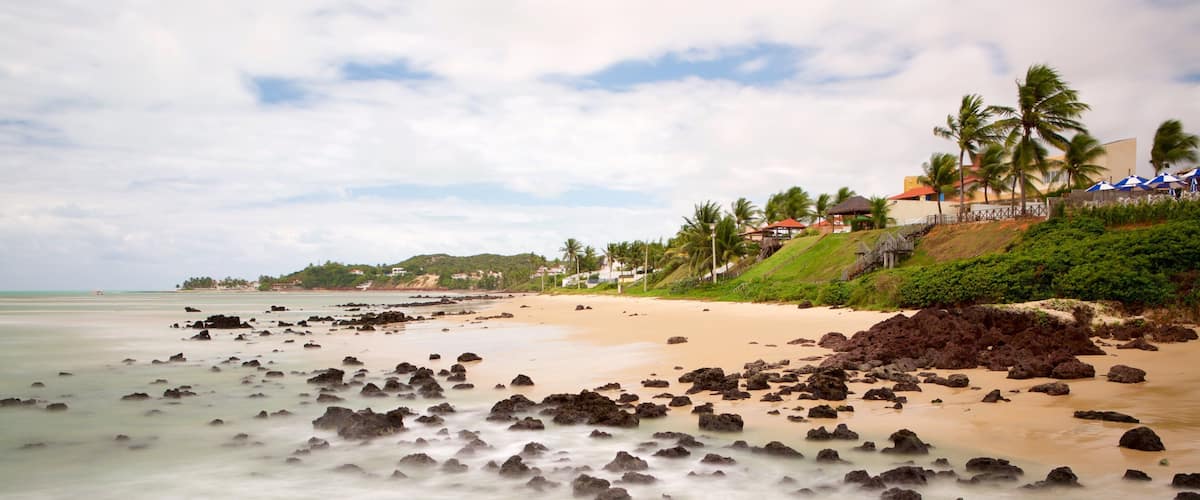 Pirangi Beach which includes general coastal views, tropical scenes and a sandy beach