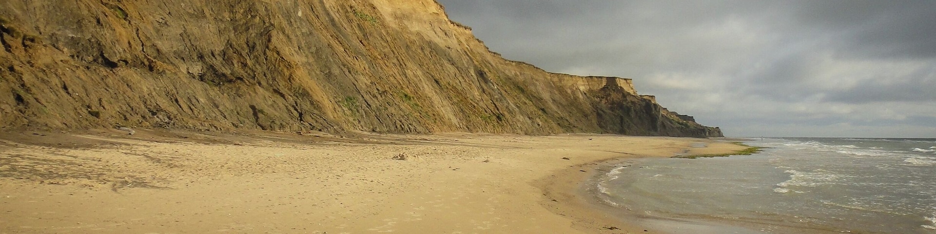 I remember walking along the beach in north #Jutland, close to the small Danish town of Lønstrup. An eroding coast line has caused the cliffs to recede, and so, atop the cliffs there were several abandoned structures. Staring out into the North Sea on that windy day was a surreal experience and reminded me that the world can open up opportunities in funny ways. A year earlier, I met some people at a course in Ann Arbor, Michigan. We were all from different cities and areas of the world. A year later, we found ourselves in northern #Denmark. Life is a funny thing.
#Europe #Travel #Lonstrup