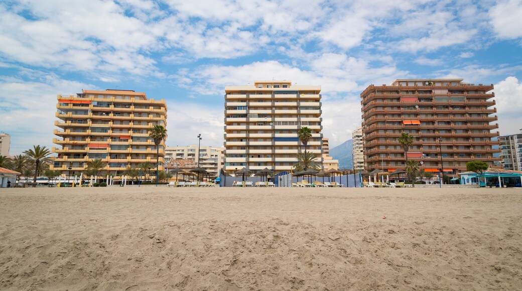 Las Gaviotas Beach which includes general coastal views, a sandy beach and a coastal town