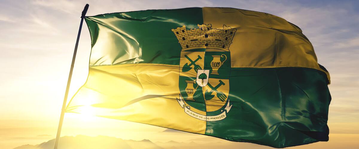 Sabana Grande of Puerto Rico flag waving on the top sunrise mist fog